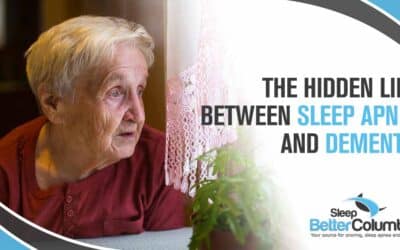 Image of an older woman with a longing expression looking out the window, representing contemplation and health concerns. Featuring Sleep Better Columbus and highlighting the hidden link between sleep apnea and dementia.